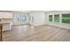 Bright living room with hardwood floors and ample windows and natural light at 3974 Brushy St, Powder Springs, GA 30127