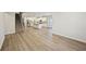 Open-concept living area with stairs, kitchen, and lots of natural light at 3974 Brushy St, Powder Springs, GA 30127