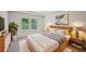 Warm, modern bedroom with wood furniture, decor, and windows providing ample natural light at 3974 Brushy St, Powder Springs, GA 30127