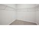 Spacious walk-in closet with carpet and white walls with wire shelving for storage at 3974 Brushy St, Powder Springs, GA 30127