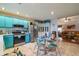 Bright eat-in kitchen with stainless steel appliances, tiled floor and adjacent living area at 4585 Post Ridge Ln, Lithonia, GA 30038