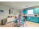 Bright eat-in kitchen with stainless steel appliances, tiled floor and view to the backyard at 4585 Post Ridge Ln, Lithonia, GA 30038