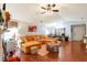 Bright living room with stylish decor, a large sectional sofa, hardwood floors, and plenty of natural light at 4585 Post Ridge Ln, Lithonia, GA 30038