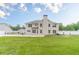 Well-maintained backyard featuring a lush lawn, patio, and a privacy fence at 1349 Mckinsey Rdg, Loganville, GA 30052