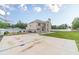 Spacious backyard featuring a basketball court, lush lawn, and a privacy fence at 1349 Mckinsey Rdg, Loganville, GA 30052
