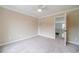 Cozy bedroom featuring plush carpeting, tree-themed wall art, and ample natural light at 1349 Mckinsey Rdg, Loganville, GA 30052