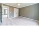 Large bedroom features light-colored carpet, ceiling fan, and an open doorway at 1349 Mckinsey Rdg, Loganville, GA 30052
