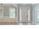 Bright entryway with hardwood floors, white trim, and a welcoming front door with sidelights at 1349 Mckinsey Rdg, Loganville, GA 30052