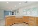 Bright kitchen featuring custom wood cabinets, stainless steel appliances, a farmhouse sink, and modern white countertops at 1349 Mckinsey Rdg, Loganville, GA 30052