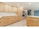 Spacious kitchen featuring custom cabinets, stainless appliances, and a layout perfect for cooking and entertaining at 1349 Mckinsey Rdg, Loganville, GA 30052