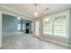 Eat-in kitchen area adjacent to the living room and featuring a door to the exterior at 1349 Mckinsey Rdg, Loganville, GA 30052