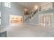 Spacious living room with a fireplace and view into an open-concept kitchen at 1349 Mckinsey Rdg, Loganville, GA 30052