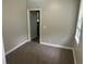 Small bedroom with neutral paint and carpet, and a single window with blinds at 2076 Garden Cir, Decatur, GA 30032