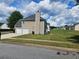 Well-kept home with an attached two-car garage and a neatly mowed, grassy backyard at 4279 Persian Ct, Snellville, GA 30039