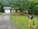 Charming single-story brick home with an attached garage and a well-manicured front lawn at 5703 Kimberly Ln, Norcross, GA 30071