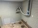 Laundry room with wood-paneled walls, simple flooring, and hookups at 5703 Kimberly Ln, Norcross, GA 30071