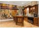 Unique bar area with custom mural, wooden cabinets, granite countertop, and wood flooring at 939 Middle Fork Trl, Suwanee, GA 30024