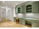 Convenient office space featuring custom cabinets, hardwood floors, and a built-in desk at 939 Middle Fork Trl, Suwanee, GA 30024