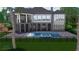 The backyard features a large in-ground swimming pool and patio for outdoor entertaining at 939 Middle Fork Trl, Suwanee, GA 30024