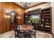Elegant wine cellar featuring custom wood shelving, tile flooring, and wood accents at 939 Middle Fork Trl, Suwanee, GA 30024