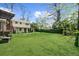 A large, green backyard shows well-maintained lawn and a partially visible house at 1436 Diamond Head Drive Dr, Decatur, GA 30033