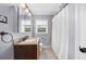 Bathroom with gray walls, granite countertop vanity, and a shower with a curtain at 1436 Diamond Head Drive Dr, Decatur, GA 30033