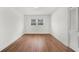 Well-lit bedroom with hardwood floors, neutral walls, and a window offering serene views at 1436 Diamond Head Drive Dr, Decatur, GA 30033