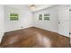 Bright bedroom with hardwood floors, two windows, a ceiling light, and a closet at 1436 Diamond Head Drive Dr, Decatur, GA 30033