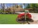 Well-manicured lawn and driveway leading to garage, enhanced by colorful landscaping at 1436 Diamond Head Drive Dr, Decatur, GA 30033