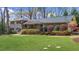Well-maintained two-story home with lush green lawn and mature landscaping at 1436 Diamond Head Drive Dr, Decatur, GA 30033
