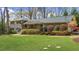 Charming two-story home with manicured landscaping, a well-kept lawn, and a inviting front porch at 1436 Diamond Head Drive Dr, Decatur, GA 30033