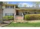 Well-maintained home exterior featuring manicured landscaping, a welcoming front porch, and classic architectural details at 1436 Diamond Head Drive Dr, Decatur, GA 30033
