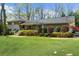 Beautifully landscaped front yard complements this charming two-story home, complete with a covered front porch at 1436 Diamond Head Drive Dr, Decatur, GA 30033