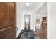 Welcoming foyer with slate tile flooring, hardwood floors, and views into the living and kitchen areas at 1436 Diamond Head Drive Dr, Decatur, GA 30033