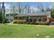 Charming front exterior featuring a well-manicured lawn and mature landscaping at 1436 Diamond Head Drive Dr, Decatur, GA 30033