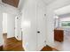 Bright hallway with wood floors and doors leading to bedrooms and a tiled bathroom at 1436 Diamond Head Drive Dr, Decatur, GA 30033