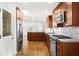 Modern kitchen features stainless steel appliances, granite countertops, and sleek cabinets at 1436 Diamond Head Drive Dr, Decatur, GA 30033
