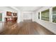 Open-concept living space with hardwood floors that connects to a kitchen area at 1436 Diamond Head Drive Dr, Decatur, GA 30033
