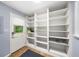 Mudroom features white storage cabinets and shelves with access to the exterior at 1436 Diamond Head Drive Dr, Decatur, GA 30033