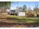 View of backyard with new wooden deck and stairs leading to house's back door at 1931 Selwyn Dr, Decatur, GA 30035