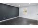 Bedroom with dark accent wall and contrasting neutral colored walls at 1931 Selwyn Dr, Decatur, GA 30035