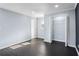 Bedroom featuring light-blue walls and wood-like flooring and closet at 1931 Selwyn Dr, Decatur, GA 30035
