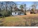 Exterior of home with black trim and nice front yard at 1931 Selwyn Dr, Decatur, GA 30035