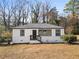 Charming single-story home featuring updated white painted brick and modern black trim details at 1931 Selwyn Dr, Decatur, GA 30035