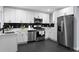 Modern kitchen featuring stainless steel appliances, white cabinetry, and sleek black tile backsplash at 1931 Selwyn Dr, Decatur, GA 30035