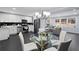 Open-concept kitchen and living area with stainless steel appliances, a dining table, and ample natural light at 1931 Selwyn Dr, Decatur, GA 30035