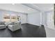 Bright living room featuring hardwood floors, updated trim and modern gray and white accents at 1931 Selwyn Dr, Decatur, GA 30035