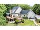 Sprawling backyard features a large deck, lush greenery, mature trees, and serene setting at 240 Rose Ridge Dr, Canton, GA 30115