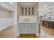 Charming bar area with granite countertop, cabinet storage, and wine glasses displayed at 240 Rose Ridge Dr, Canton, GA 30115