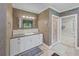 Detailed bathroom with patterned wallpaper, vanity, mirror, and a standing glass shower at 240 Rose Ridge Dr, Canton, GA 30115